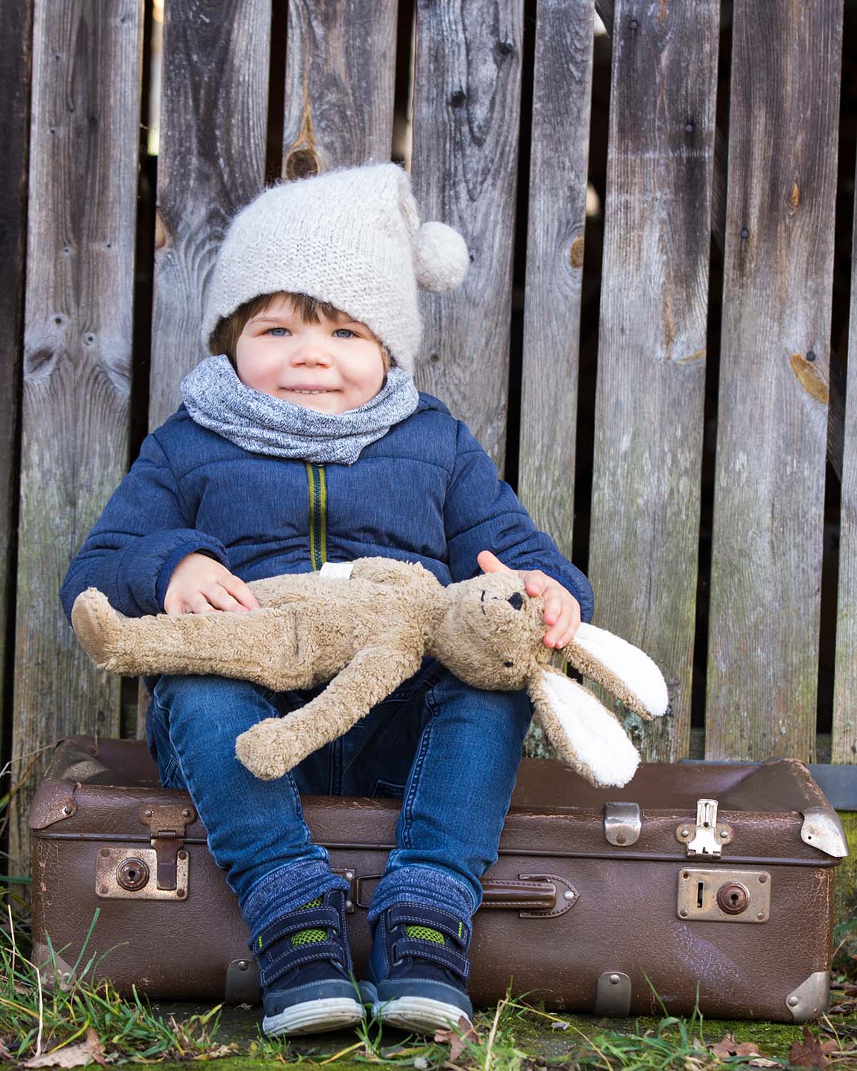 holding the Senger Large Floppy Bunny Toy in their arms