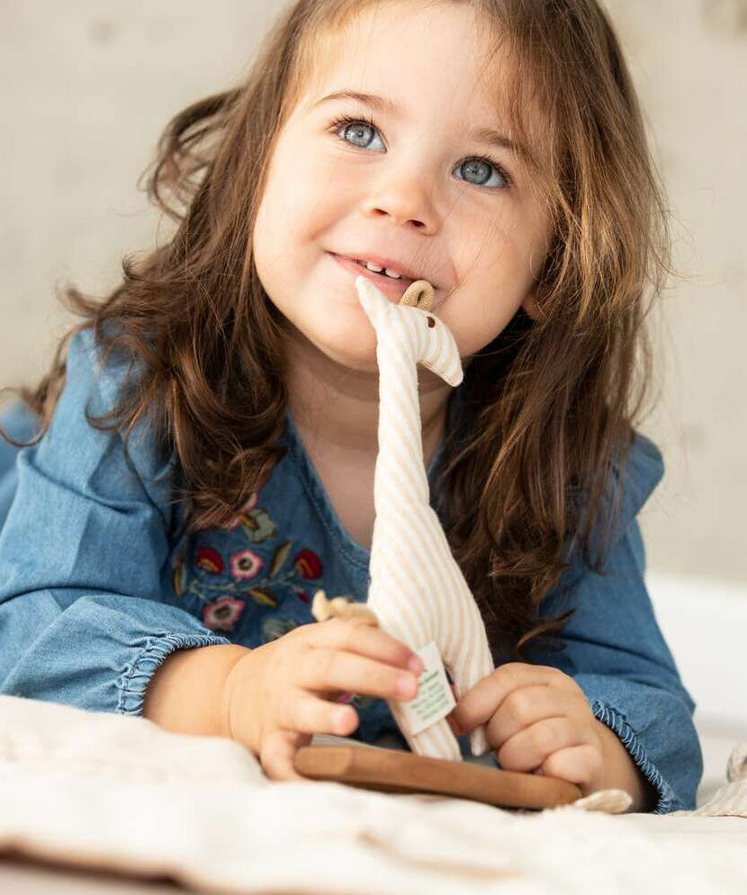 A child playing with the Senger Giraffe Grabber. 