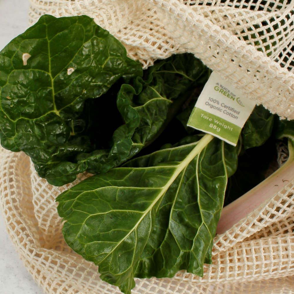 A Slice Of Green Organic Cotton Mesh Produce Bag - Extra Large containing green chard leaves