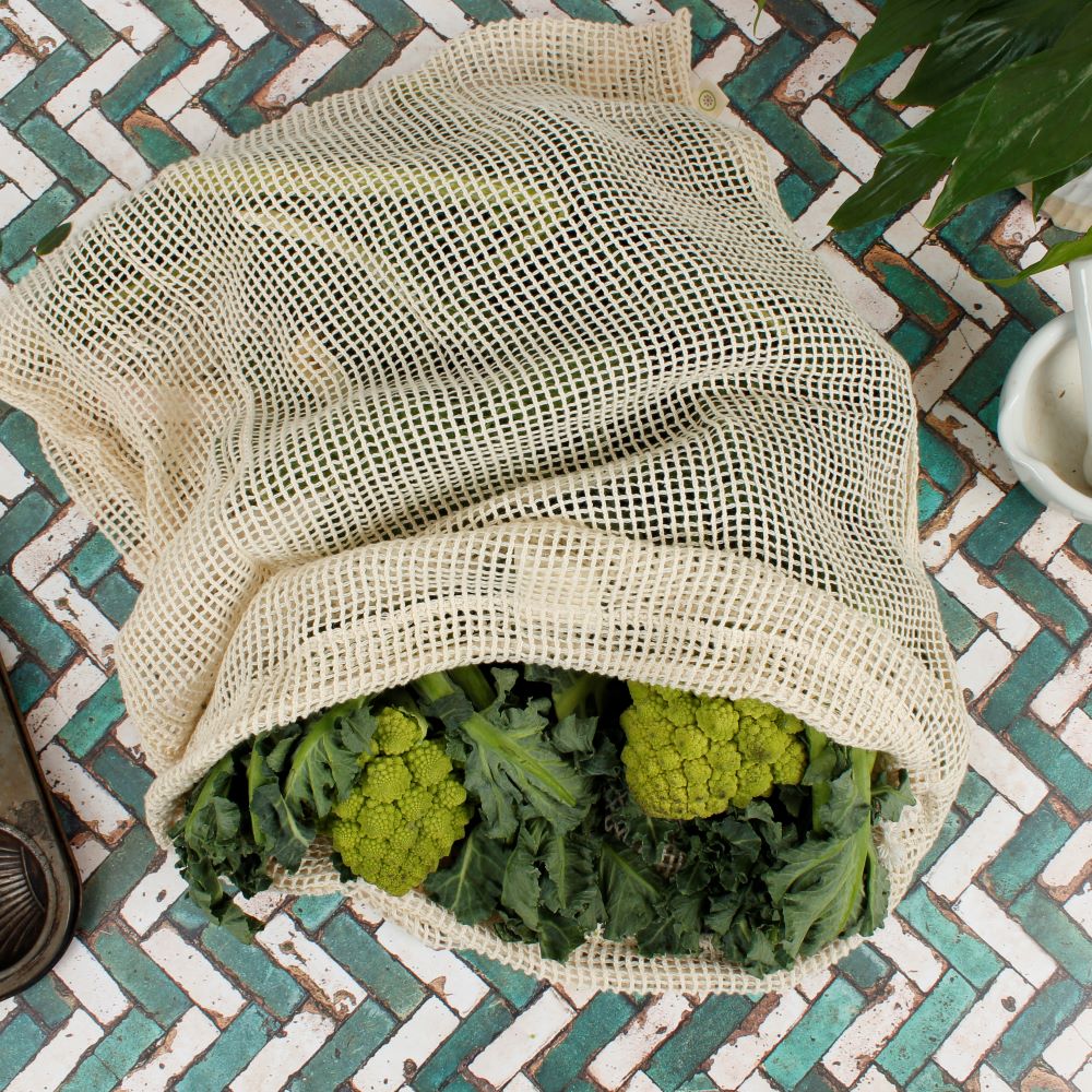 A Slice Of Green Organic Cotton Mesh Produce Bag - Extra Large folded with cardboard packaging sleeve