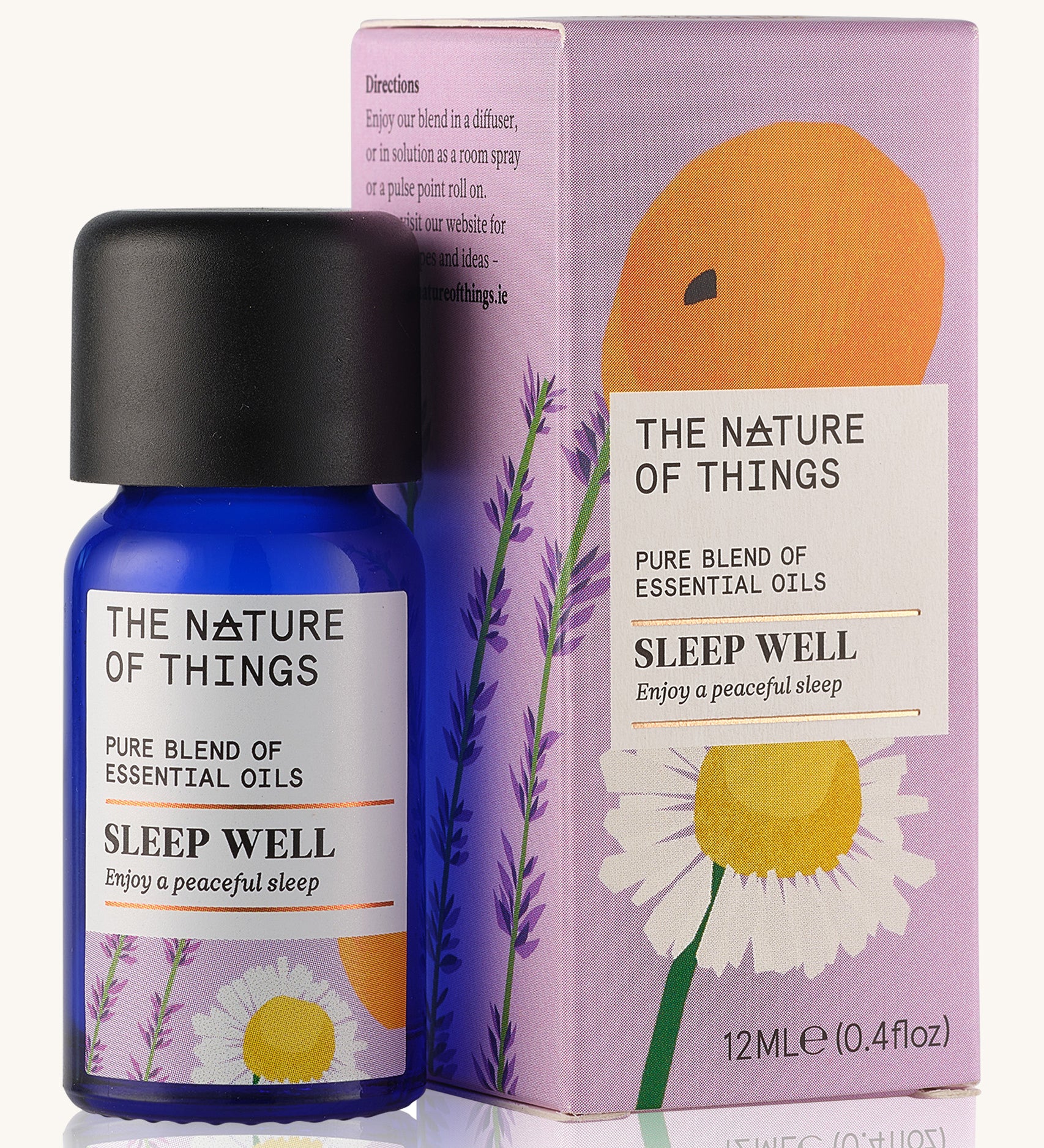 Sleep Well pure essential oil blend in a blue glass bottle in front of a decorative pink cardboard box.