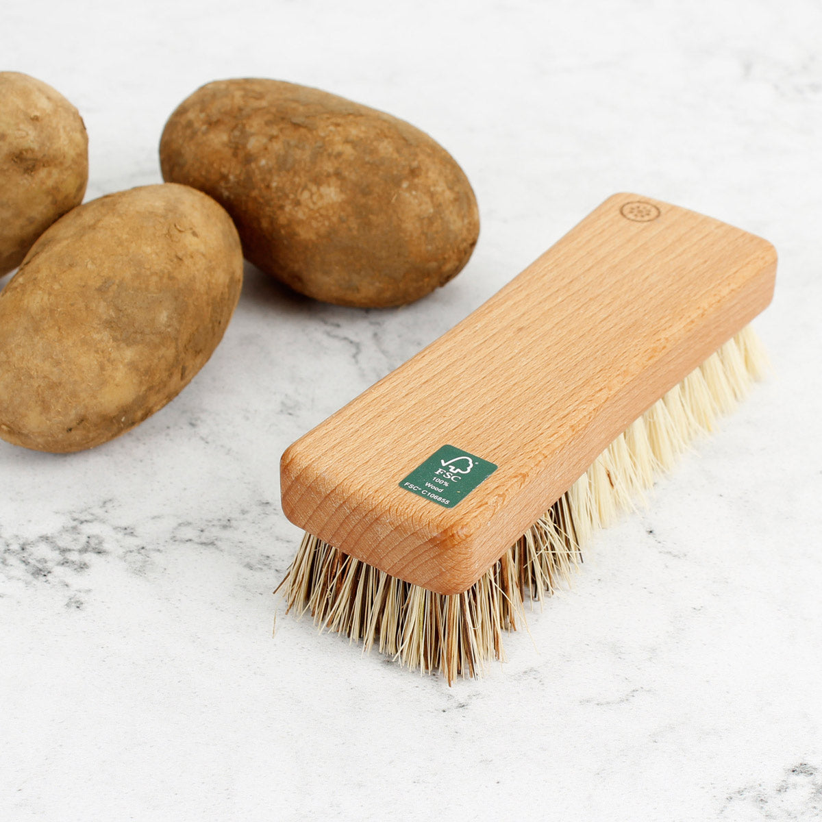 Close up of the FSC Certified sticker on the A Slice of Green plant-based vegetable cleaning brush