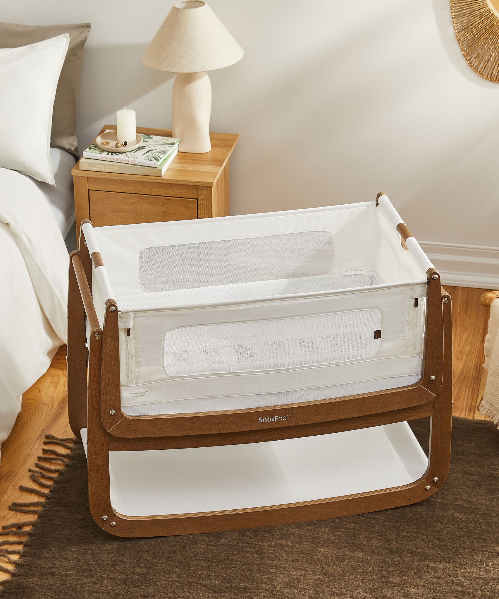 A walnut Snuzpod4 bedside crib from the Natural Edit collection 