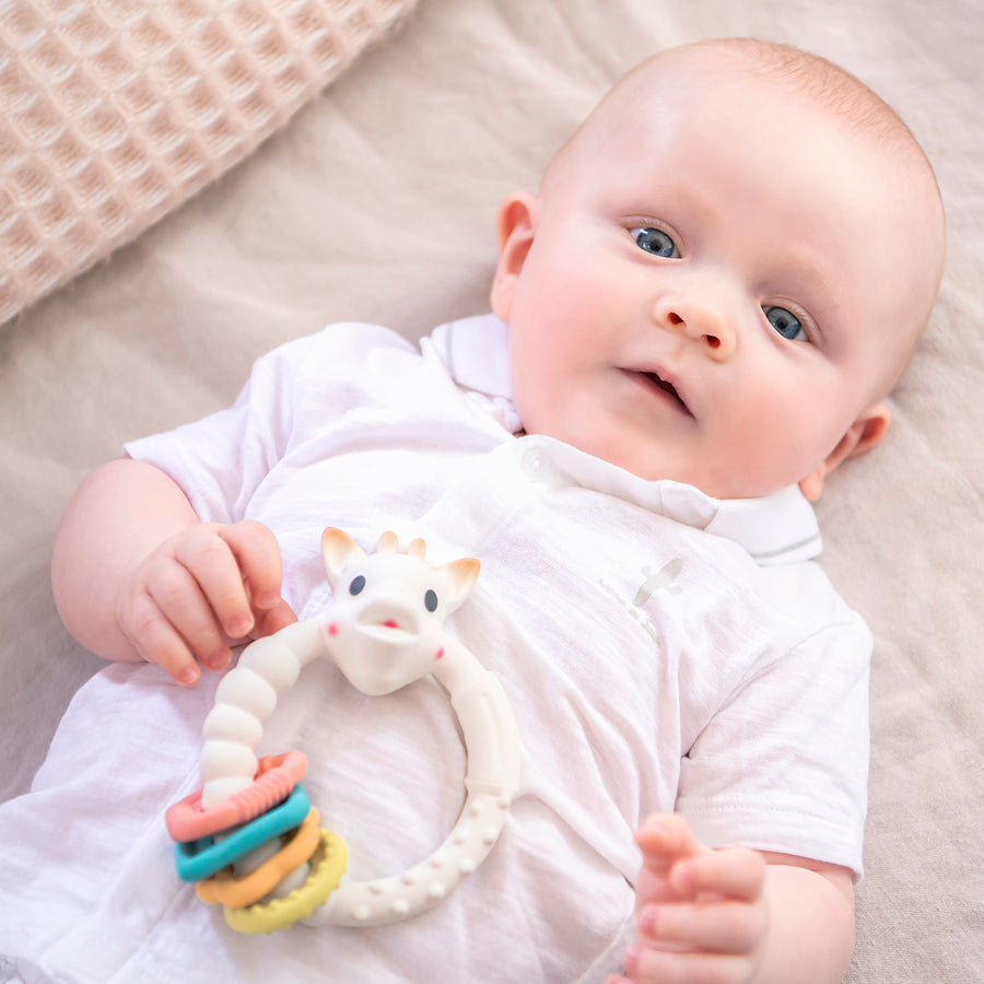  green and orange small teething rings attached