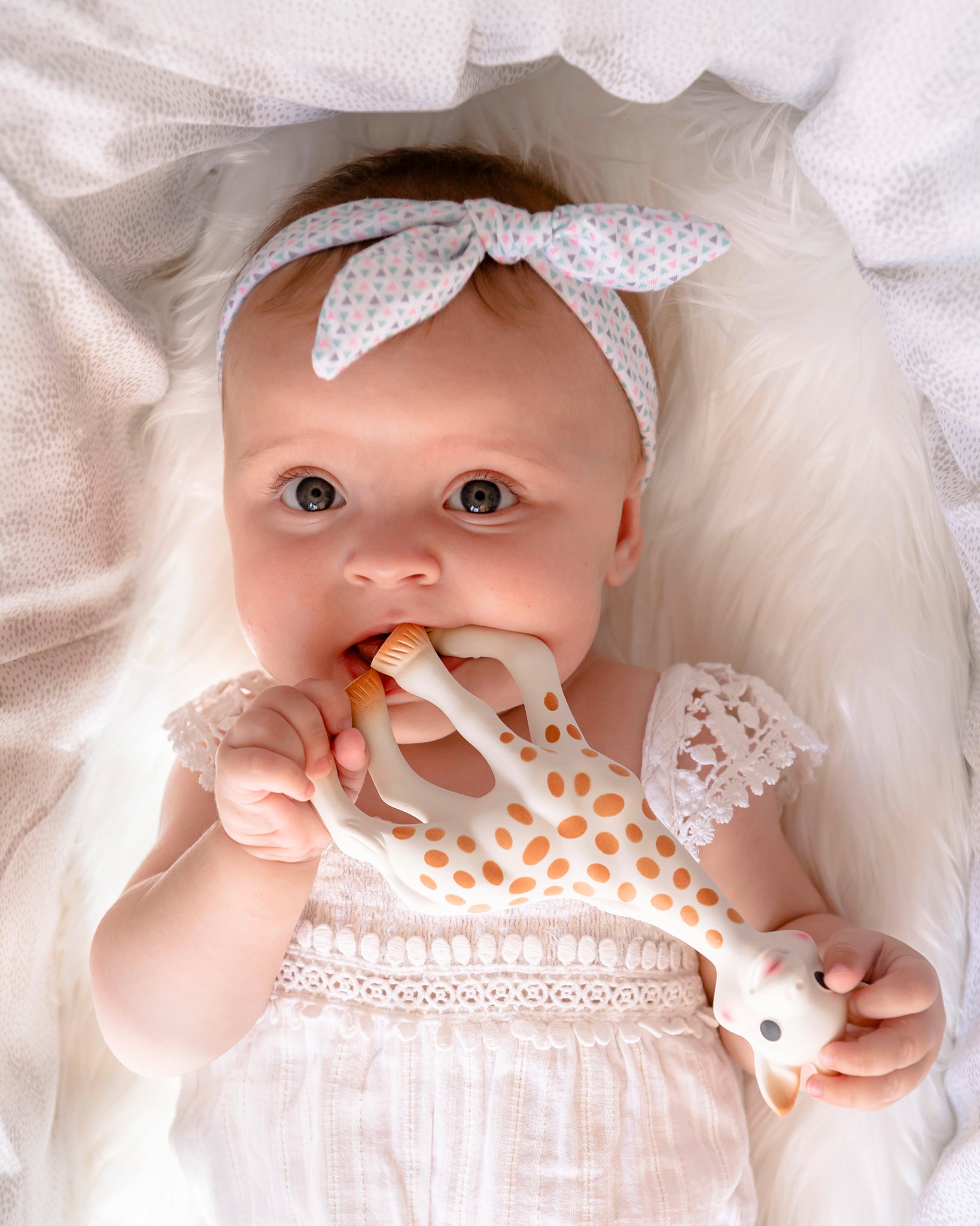 A child laid on a fluffy blanket