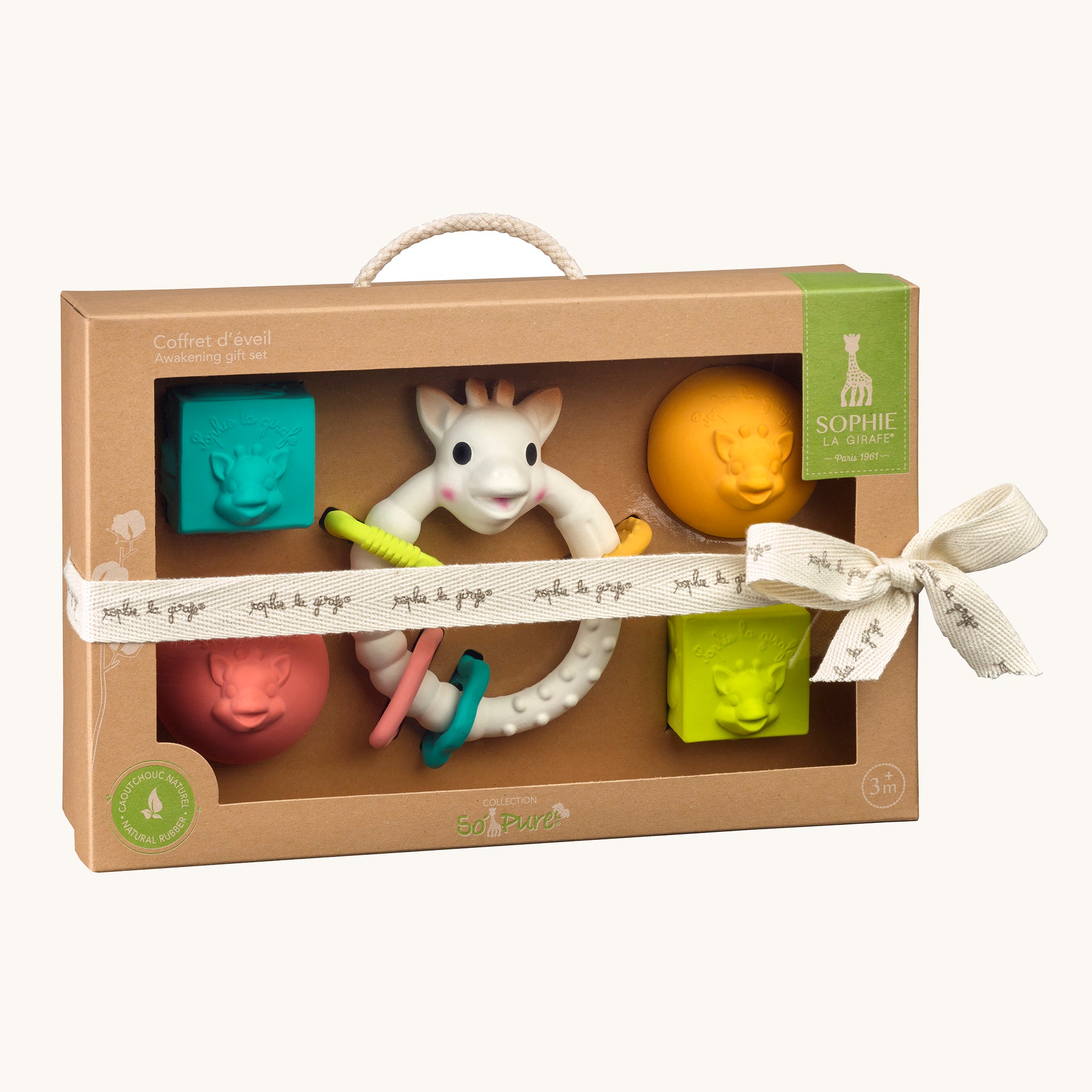 Sophie The Giraffe - So Pure Early Learning Gift Set contents in the box, with a decorative ribbon on a cream background