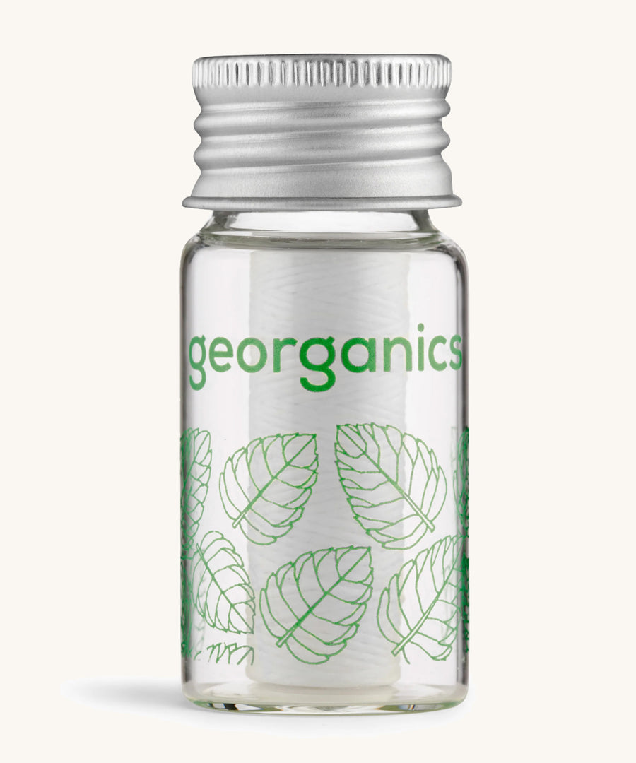 Georganics spearmint floss on a cream background