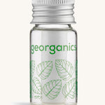 Georganics spearmint floss on a cream background