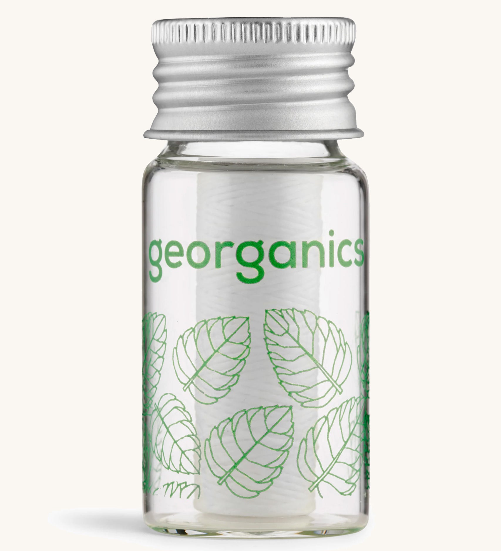 Georganics spearmint floss on a cream background