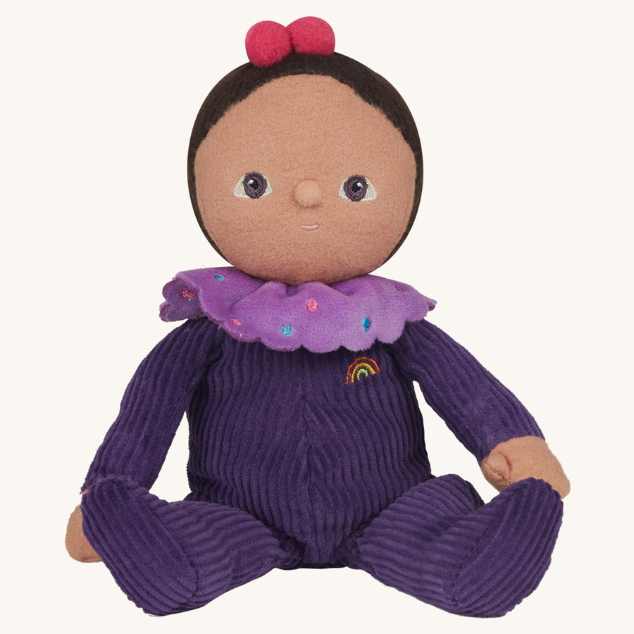 Olli Ella Dinky Dinkum Doll Sweet Treats - Freya Fondant. A soft floppy doll with a plush velvety purple onsie, dark brown hair with two cherries, and a light purple sprinkle collar, on a cream background