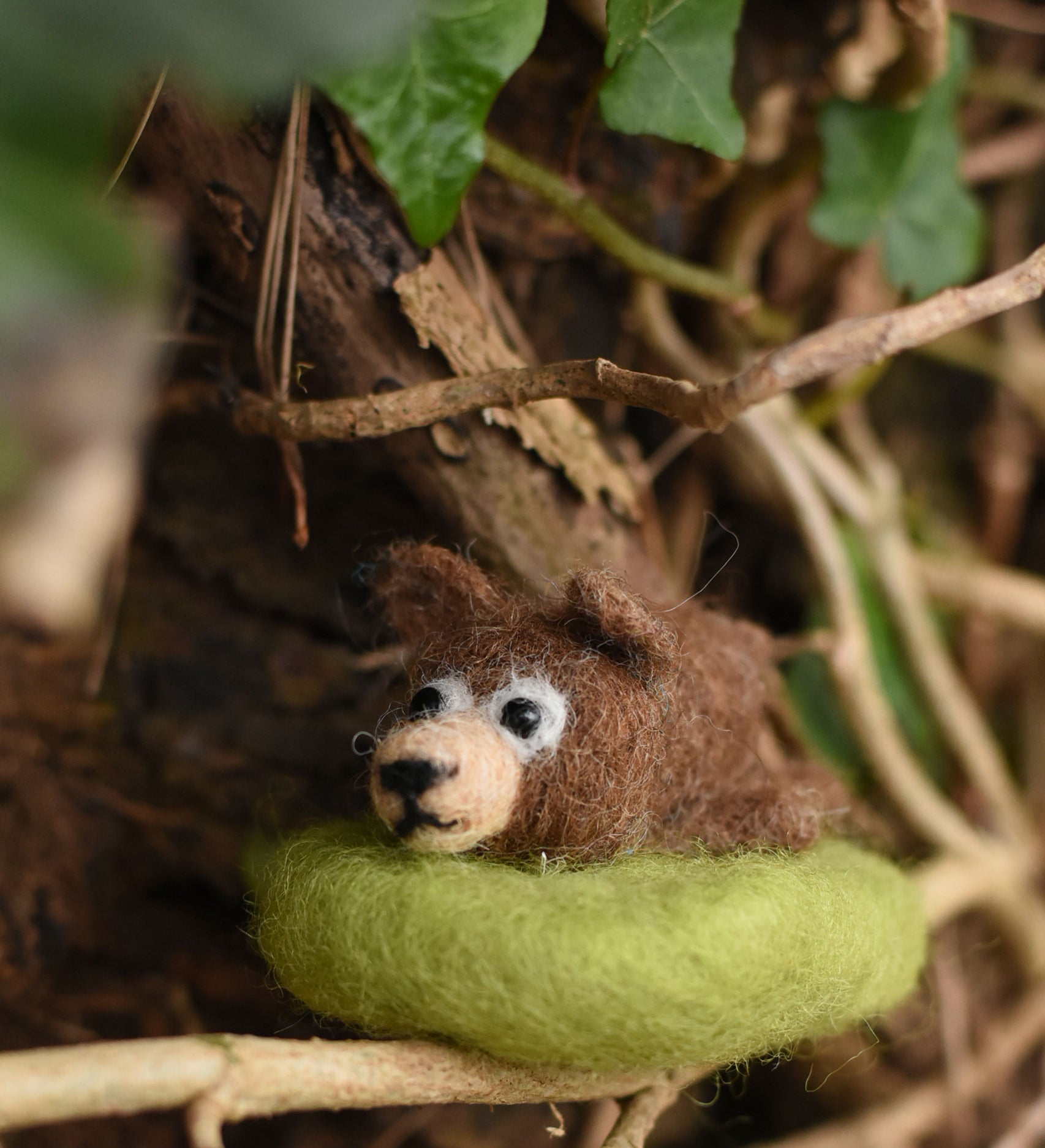 A fekted bear handmade using the The Makerss Amiguwoolli Snoozing Bear Mini Needle Felt crafting Kit.