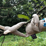 Tobe hempions soft sloth rag doll hanging from a tree branch