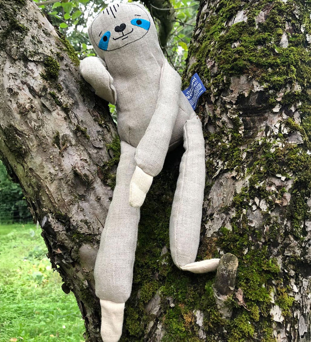 The Tobe The Hempions sloth toy placed on a tree. 