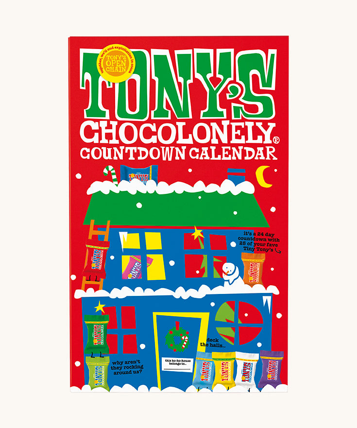 The closed red coloured box of Tony's Chocolonely advent calendar on a cream background