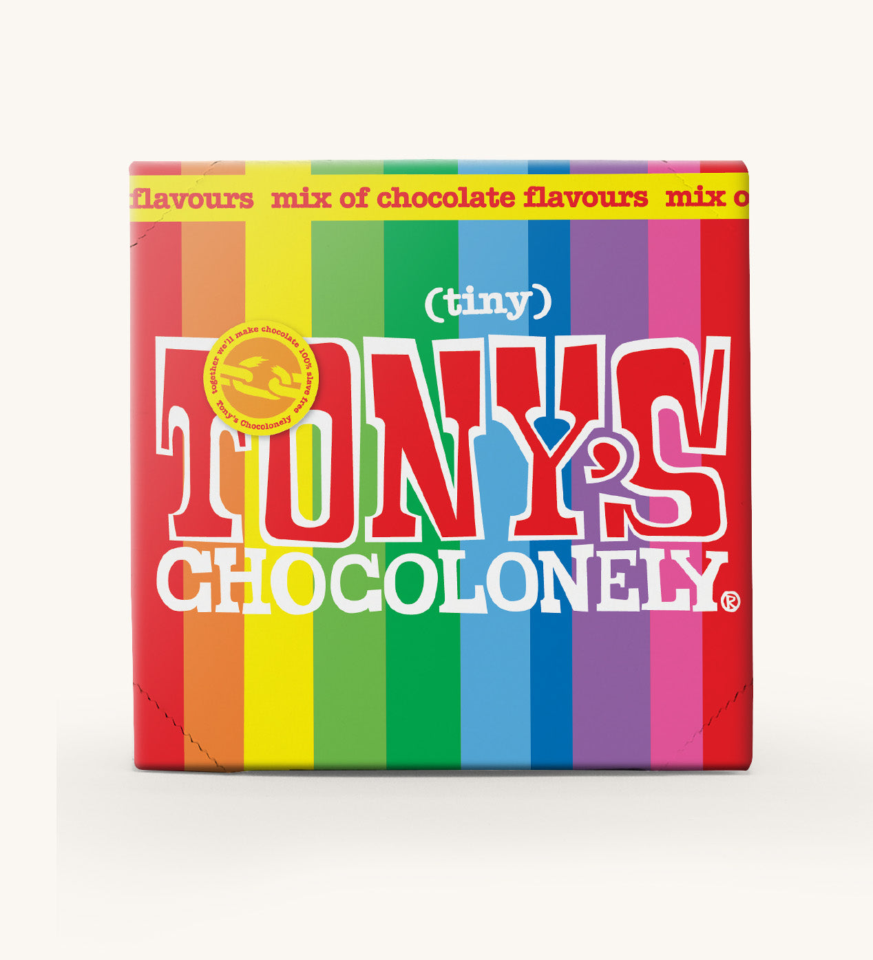 The rainbow coloured box of Tony's Chocolonely Tiny Tony's Gift Box on a cream background