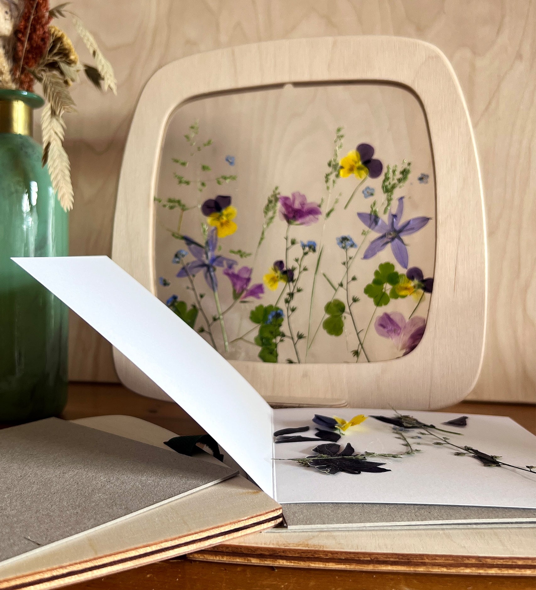  with dried pressed flowers surrounding the press