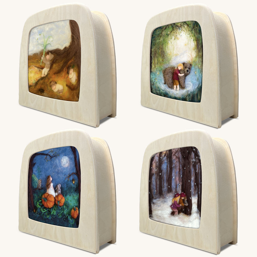 Toverlux Starter Set by Annefleur. Four beautiful felt illustrations ina  Magic Lamp box  include Mother Moon and Budding Spring on top, with Jongen Met Beer and Winter Discoveries on the bottom, on a cream background