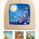 Toverlux Magic Lamp Silhouettes - Artwork By Daniela Drescher. Shown in the image is: Little Fairy Can't Sleep - Moon, Griswald Hears The Grass Grow - Swing, Griswald Hears The Grass Grow - Cake and Goodnight Sandman - Nighty Night. The images are on a cream background