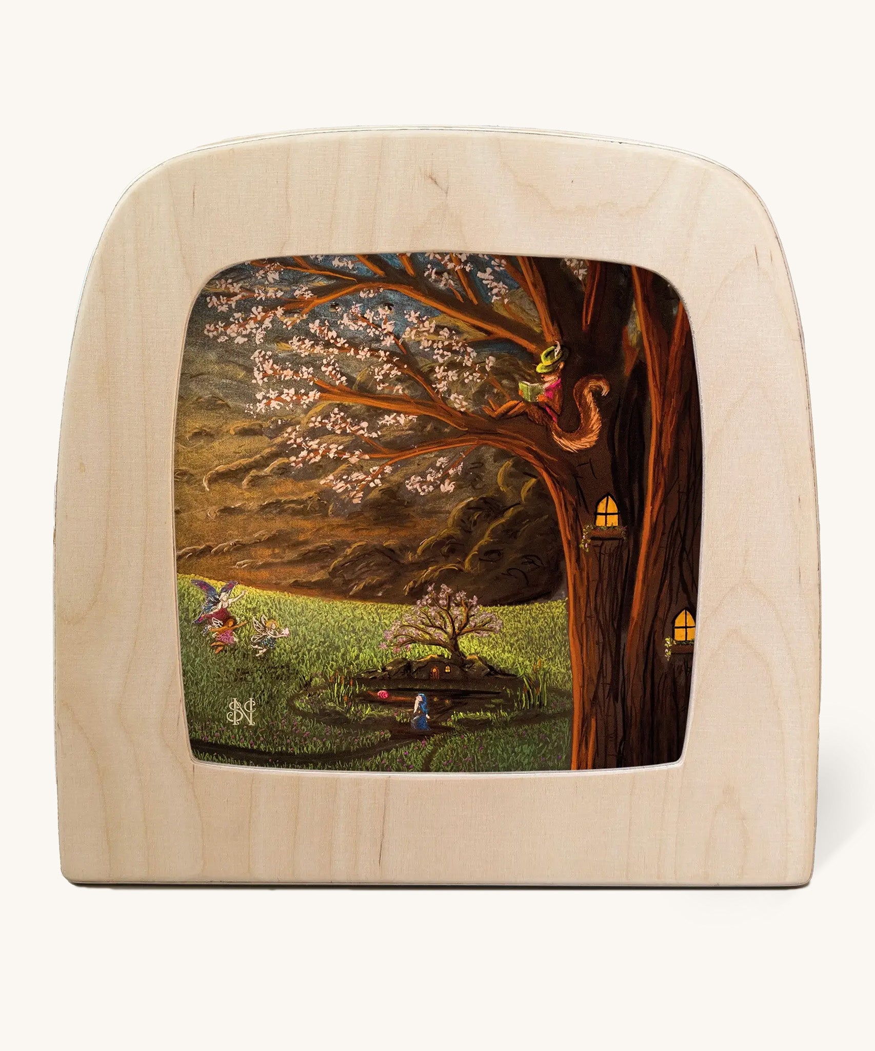 Toverlux Magic Lamp with a April silhouette by artist Nathaniel Santa Cruz. A chalk style illustration showing a blossom tree with a red squirrel overlooking a grassy field with fairies. 