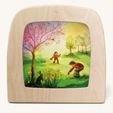 Toverlux magic lamp with a Easter discovery silhouette by artist Vogel Geluk. A watercolour style illustration of 2 children in a field looking for easter eggs.