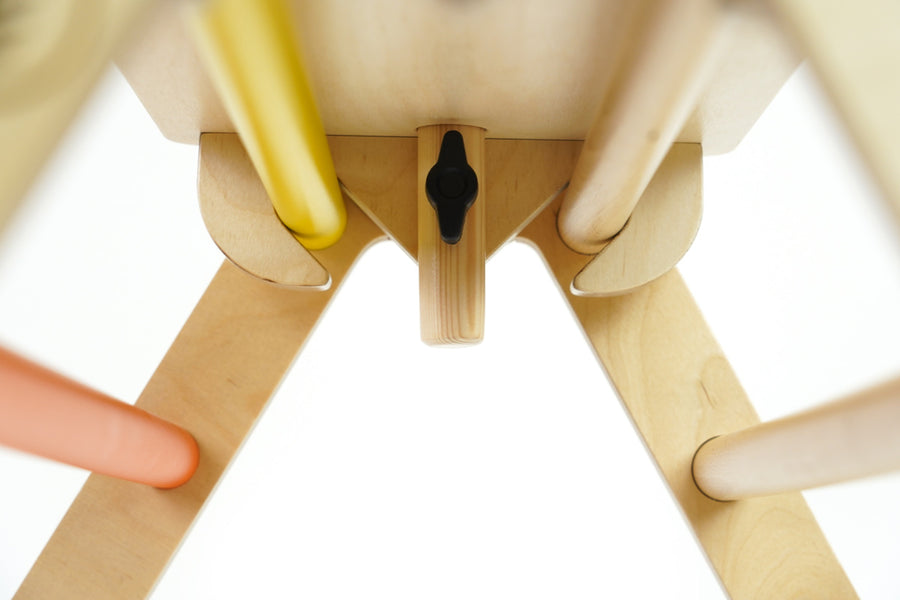 Close up of the wooden fixing on the Triclimb arben top deck and wooden steering wheel attachment on a white background