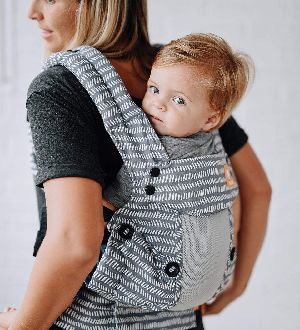 Close up of baby in a Tula explore baby carrier in the coast beyond colour