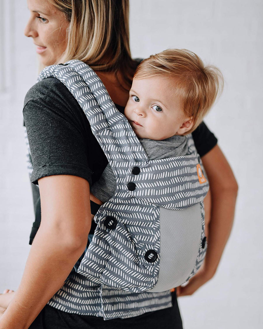 Close up of baby in a Tula explore baby carrier in the coast beyond colour