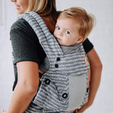 Close up of baby in a Tula explore baby carrier in the coast beyond colour