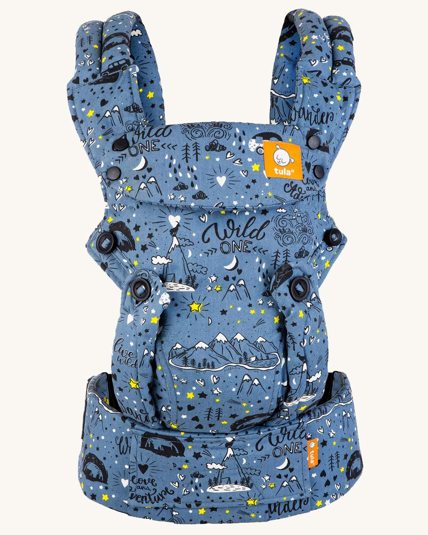 Tula Explore Baby Carrier featuring the Wander print. A blue background with black and white sketch drawings 