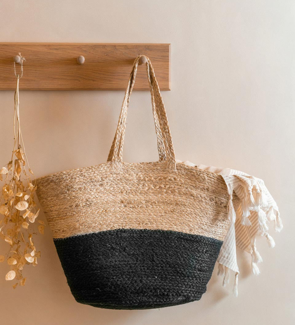 Turtle Bags black block colour jute basket hanging on a wooden coat hanger