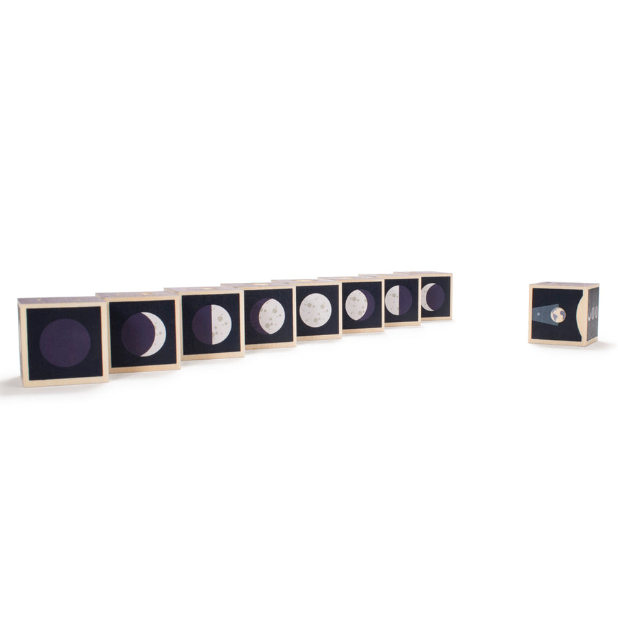 Uncle Goose eco-friendly handmade moon phase cubes lined up in order on a white background