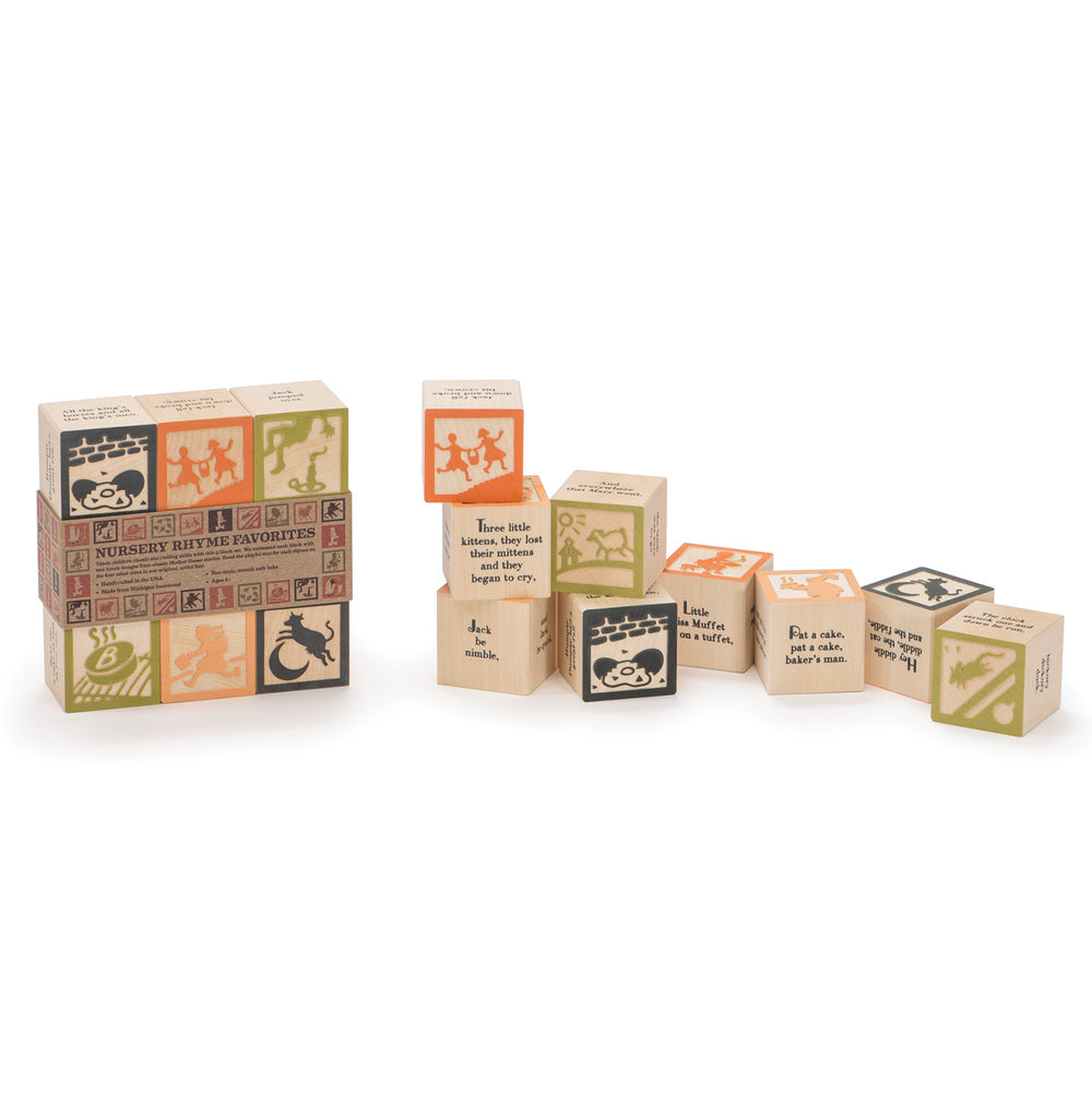 Uncle goose eco-friendly wooden nursery rhyme blocks set scattered on a white background next to their cardboard packaging