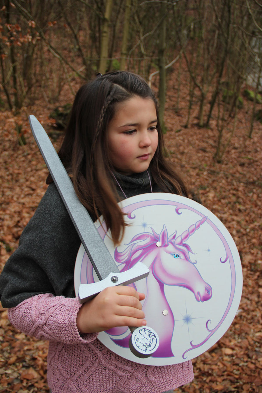 Child holding the Vah Arabella Unicorn Wooden Shield and matching sword