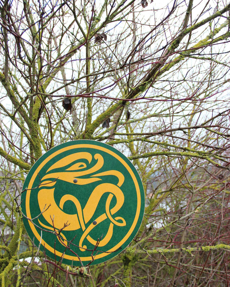 Vah Celtic Sigar Wooden Toy Shield placed on tree branches