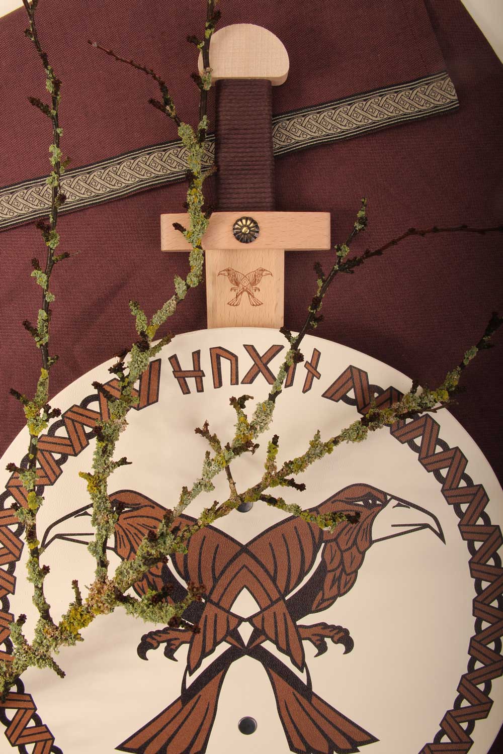 Vah Hugin & Munin Viking Round Wooden Shield with mossy branches laid on top