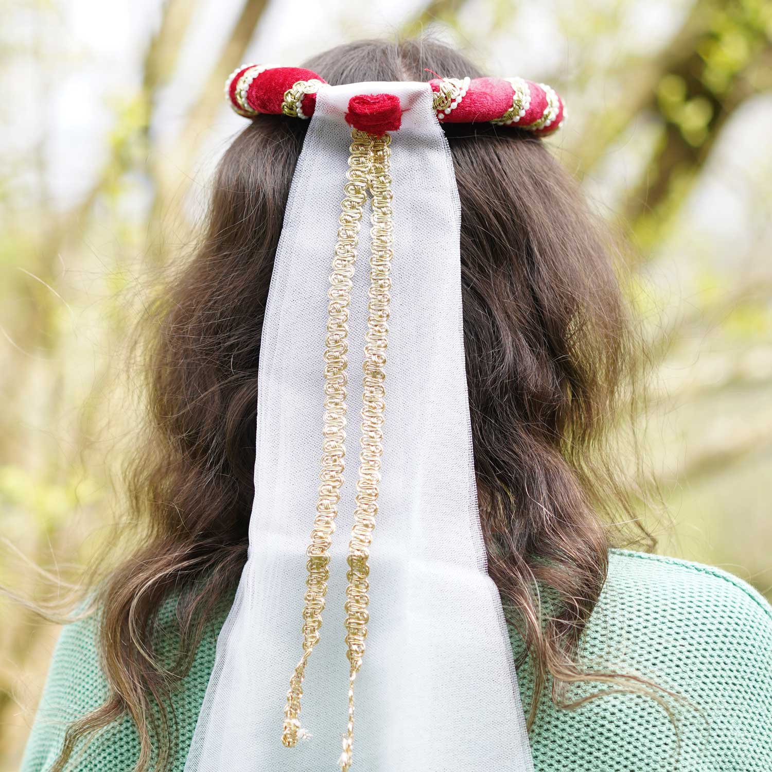 Close up of the gold detailing on the Vah Isabella Medieval Veil in Red