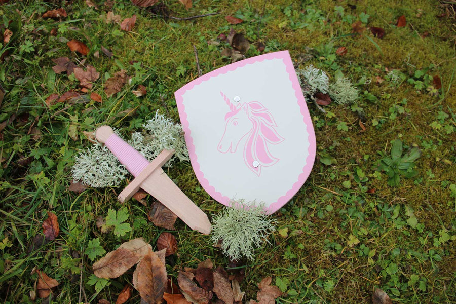 Vah Isolde Unicorn Mini Wooden Shield & Dagger Set pictured outdoors on grass