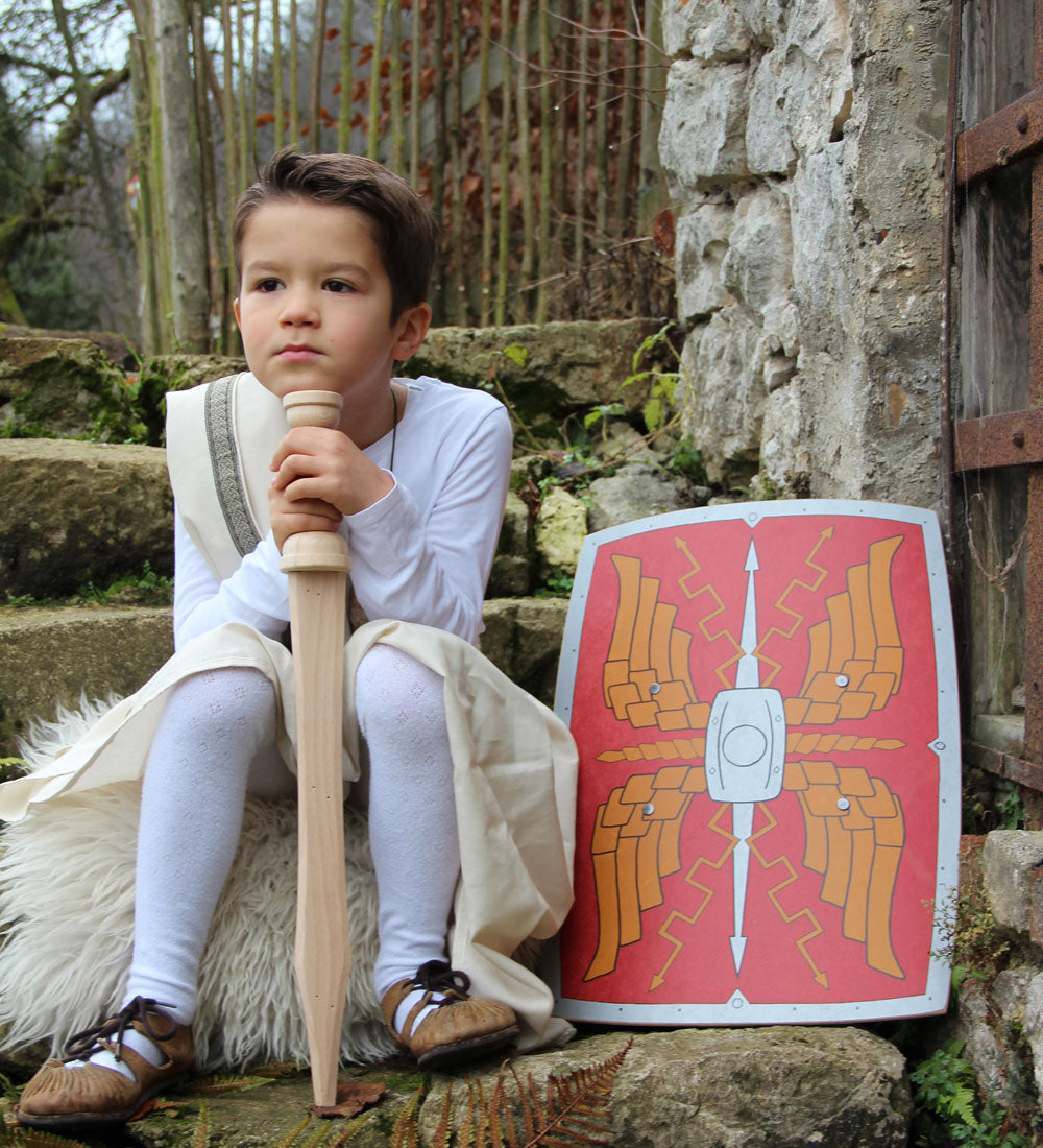 Child sitting on a step outdoors