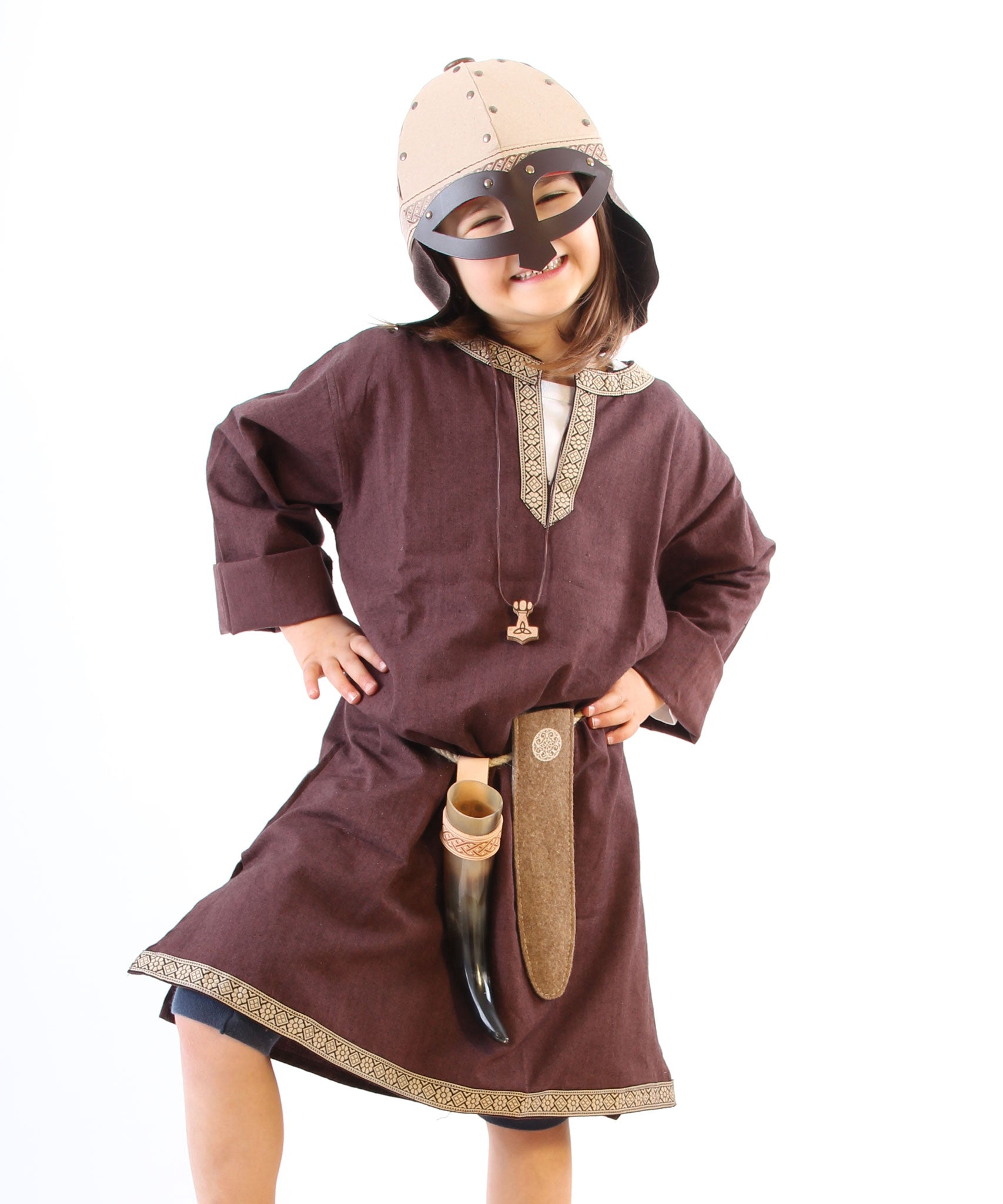 A child in full Viking costume including the Vah Viking Tunic, helmet and drinking horn. 