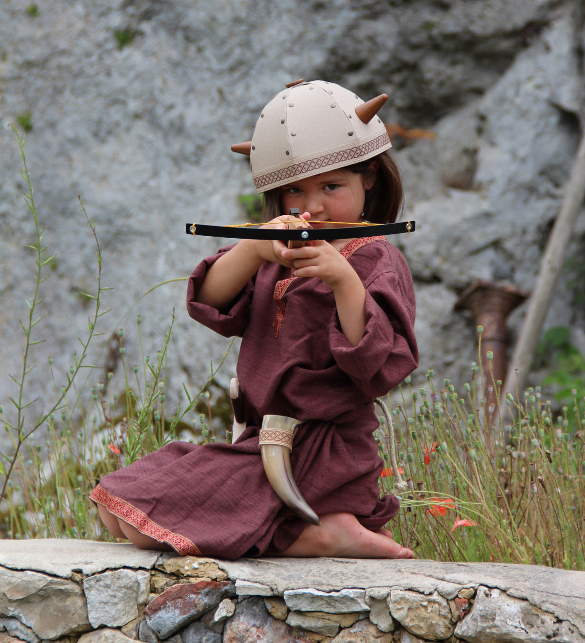 Child playing with the Vah Junior Wooden Bow toy