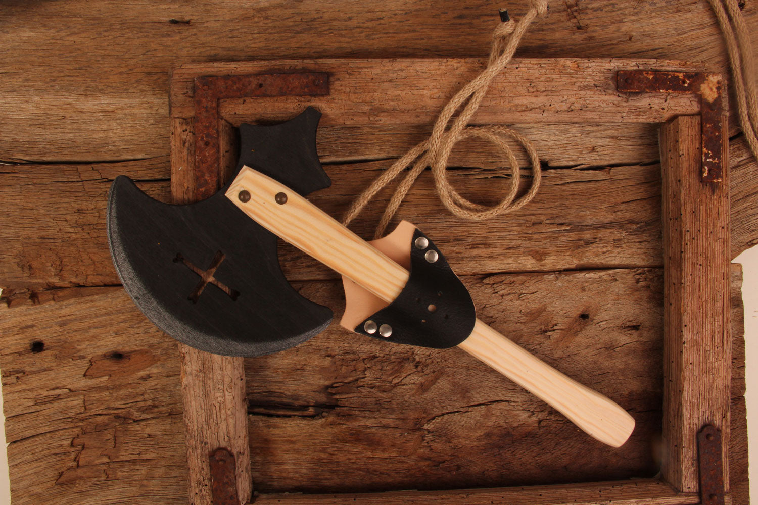 Vah Wooden Splendor Axe placed on a wooden surface in a holder