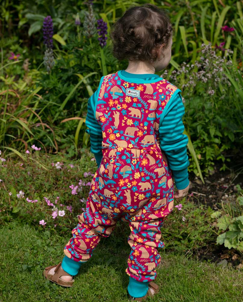 Piccalilly Honey Bear Dungarees being worn by a child