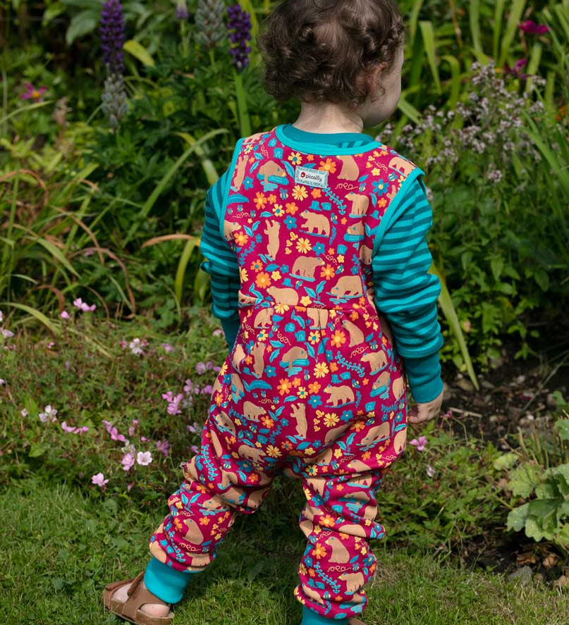 Piccalilly Honey Bear Dungarees being worn by a child