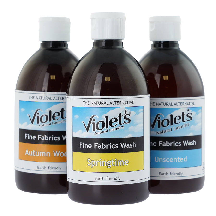 3 bottles of Violets non-toxic fine fabrics laundry liquid on a white background