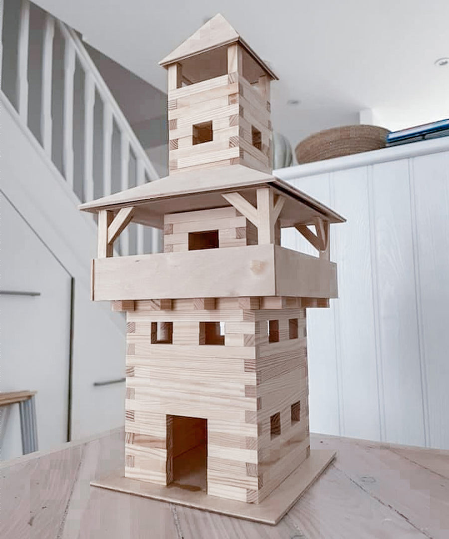 A carefully crafted WALACHIA Tower. The wooden blocks showing their natural grain sit perfectly after being glued together