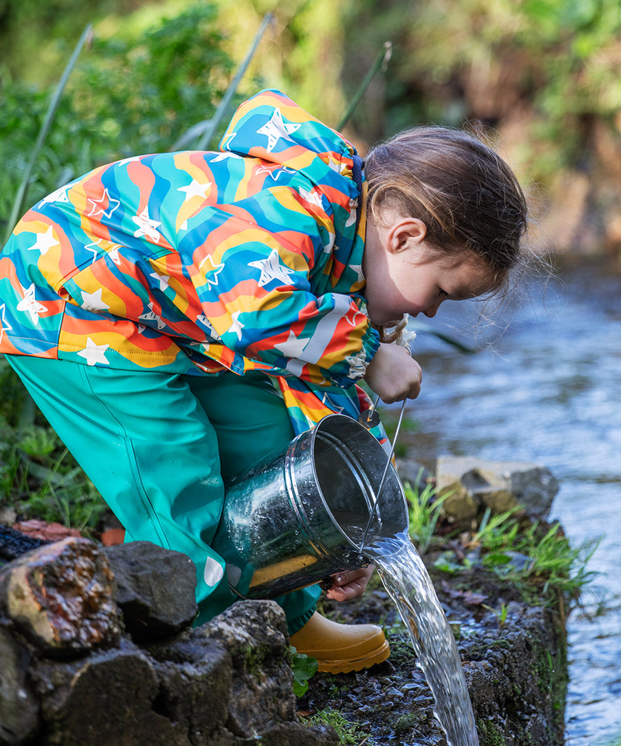 A closer look at the adjustable shoulder straps on the Frugi Children's Puddle Buster Trousers - Iguana Turquoise