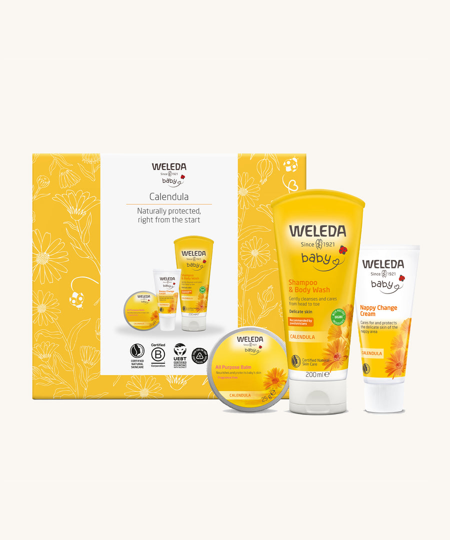 Weleda Calendula Baby Gift Set includes All Purpose Balm, Shampoo and Baby Wash, Nappy Change Cream, stood in front of the box on a cream background