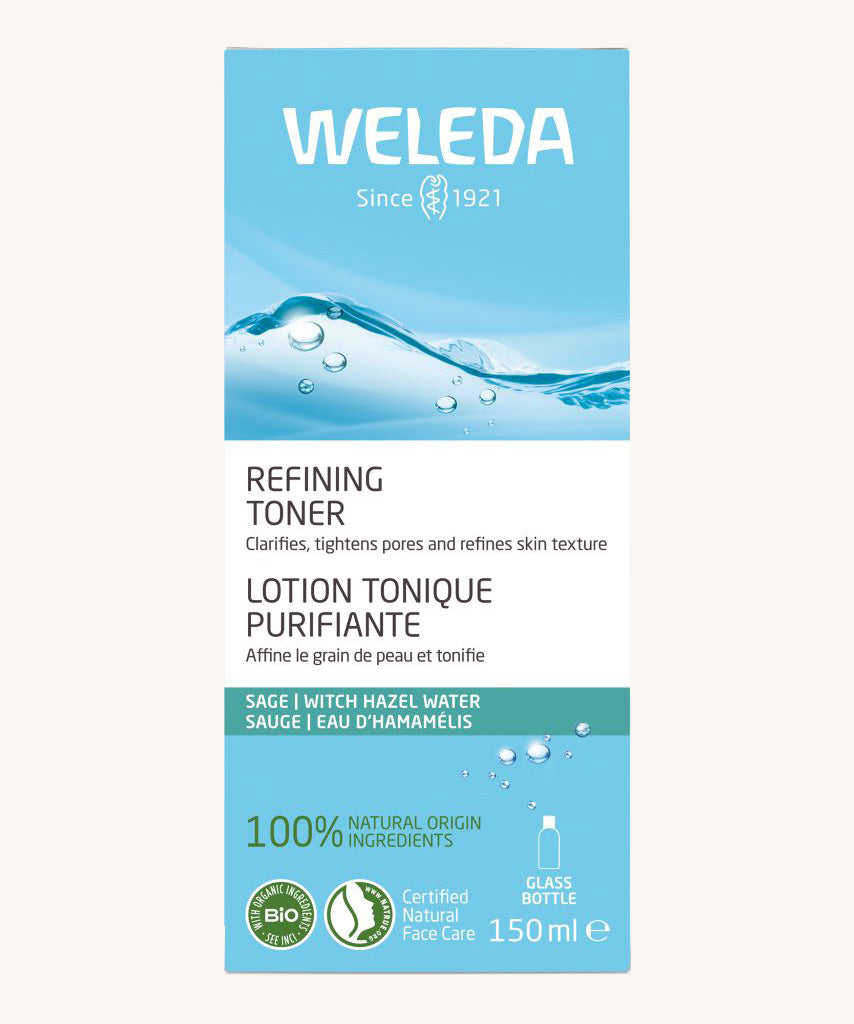 A light blue box for the refining toner with an image of water on a cream background.