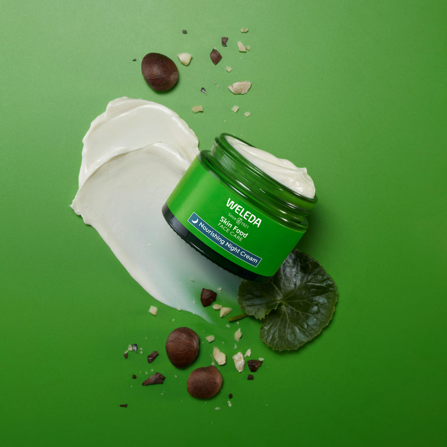 An open pot of Weleda Skin Food Nourishing Night Face Cream