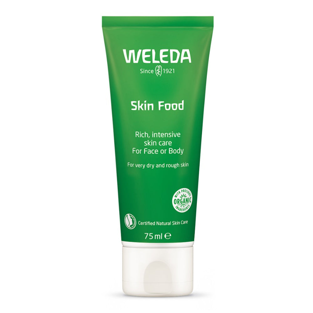 Weleda Skin Food 75ml Gren tube on a cream background.